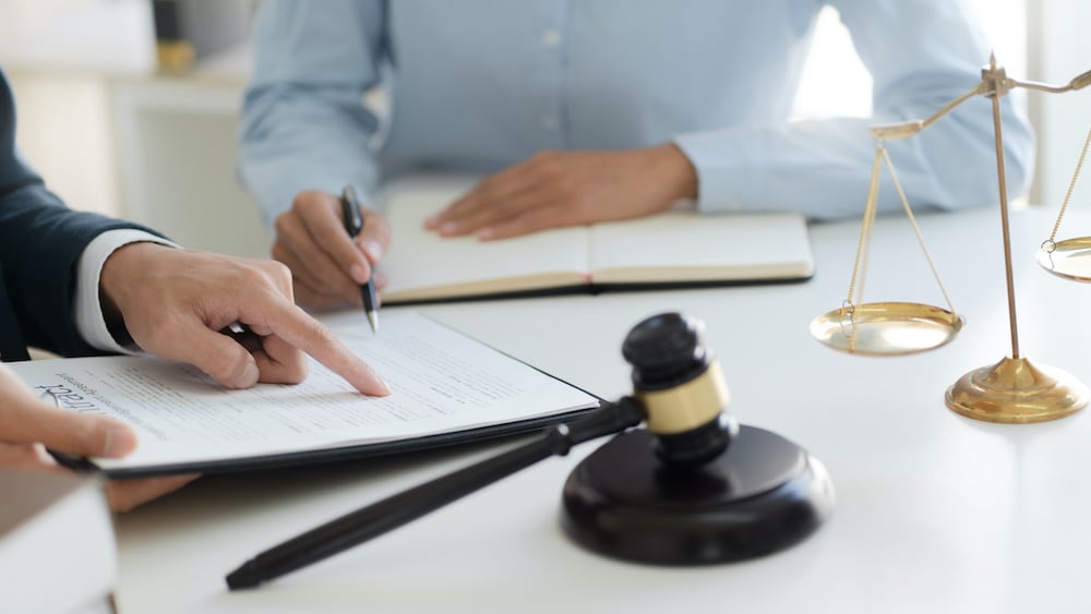 estate planning lawyer with client